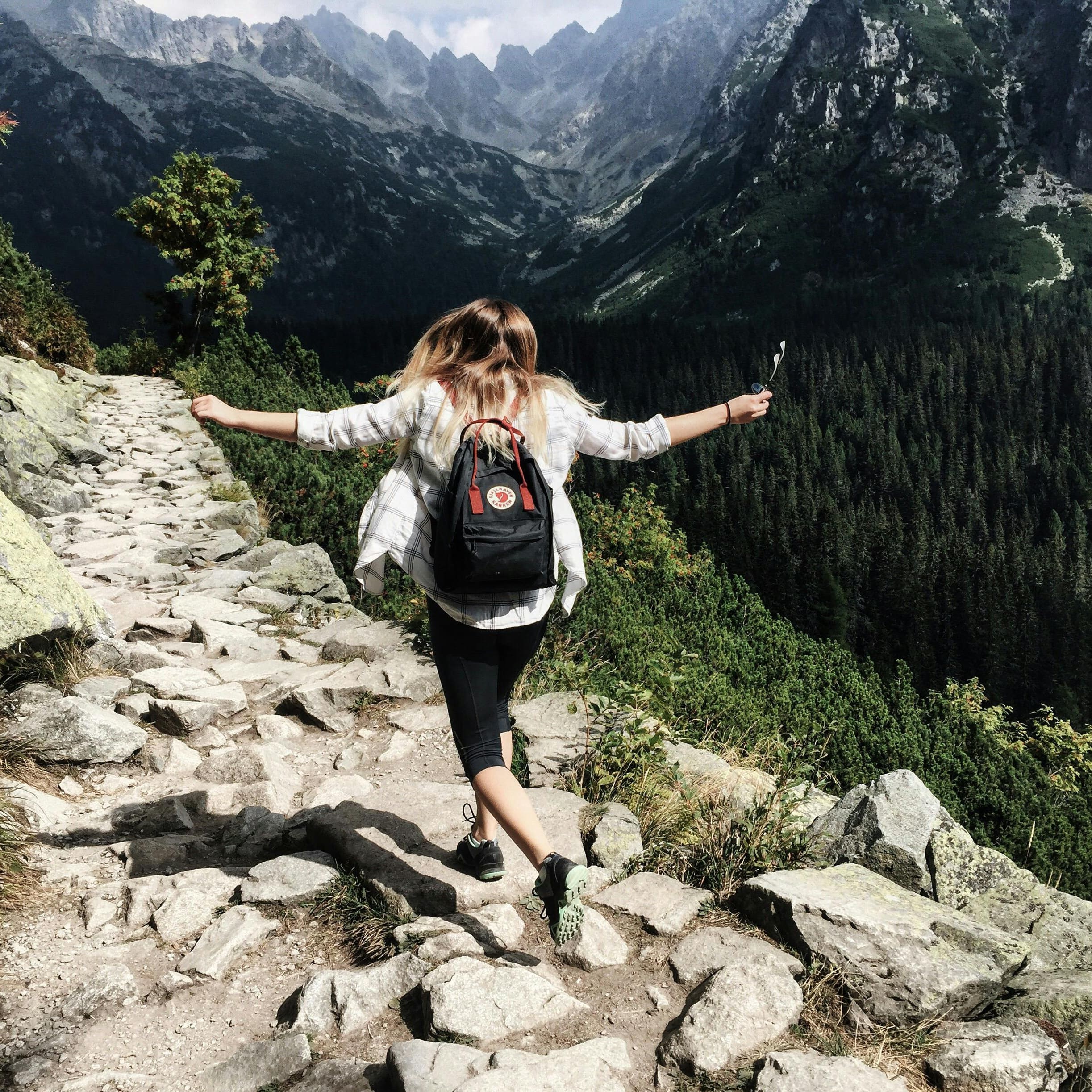 A woman on a mountain hike in the Comox Valley